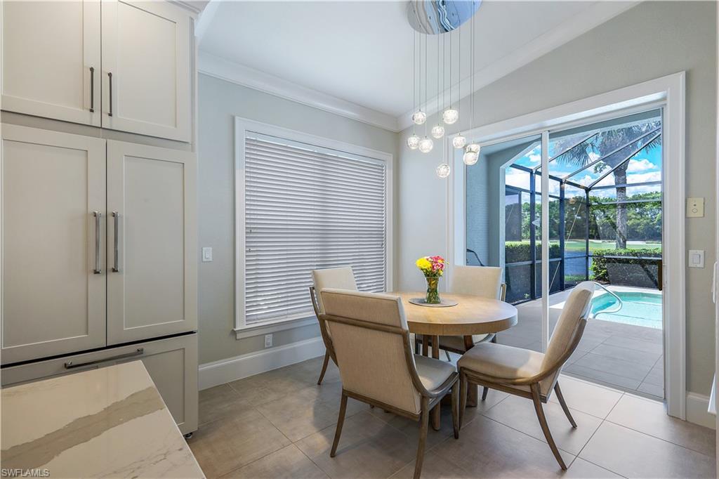 17945 Modena Road Miromar Lakes, FL 33913 - Photo 10 of 24 a dining room with furniture and window