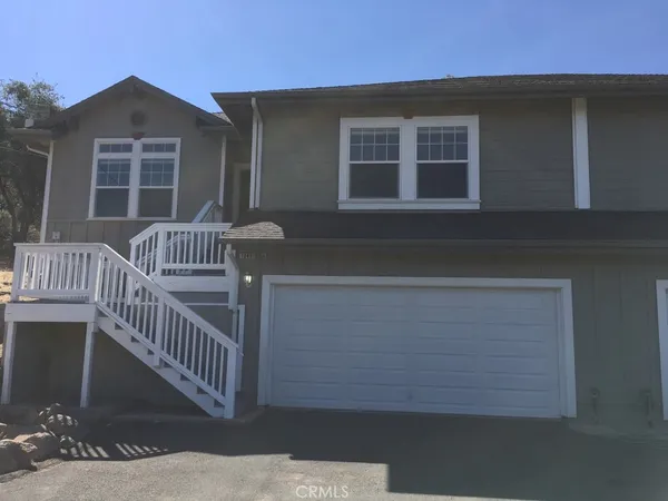 a view of house with deck and porch