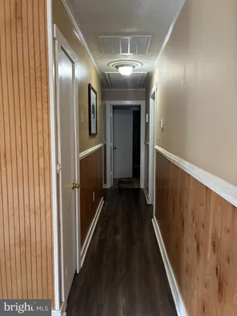 a bathroom with a shower a toilet and sink