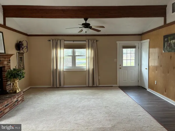 a view of an empty room and window