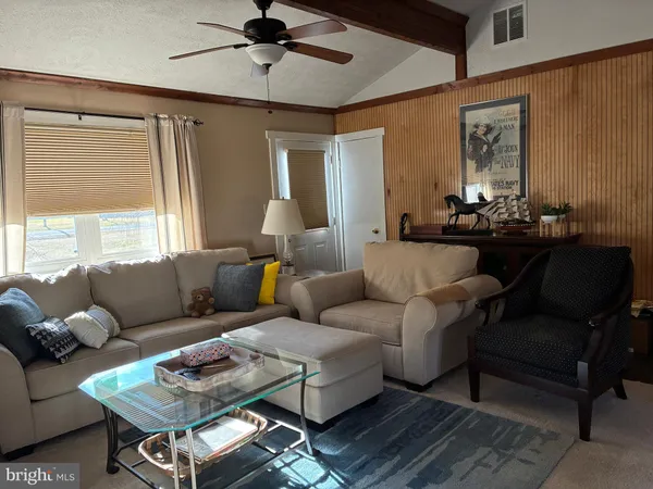 a living room with furniture and a window