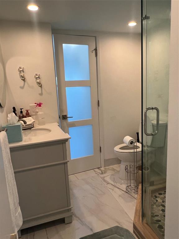 1610 North Ocean Boulevard, Unit 1202 Pompano Beach, FL 33062 - Photo 13 of 31 a bathroom with a sink toilet and shower