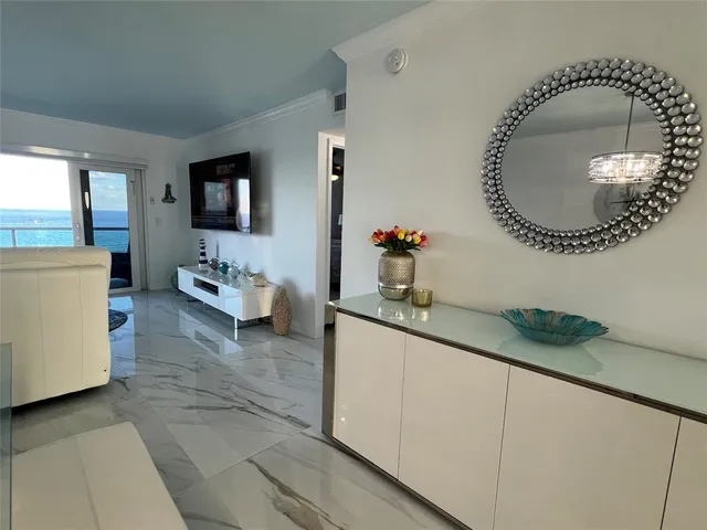 a view of a balcony with chair and glass door