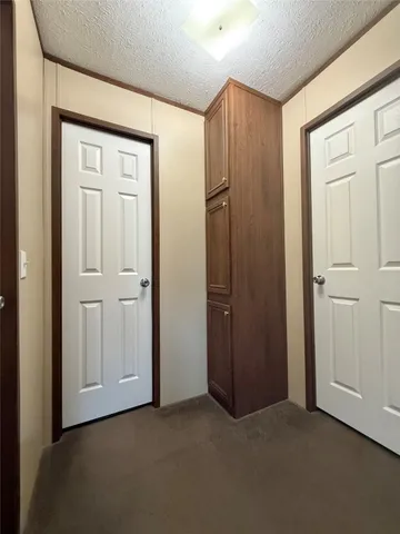 an empty room with closet area