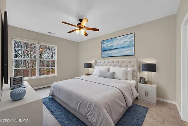 a kitchen with stainless steel appliances granite countertop a stove top oven a sink dishwasher a refrigerator and a dining table with wooden floor