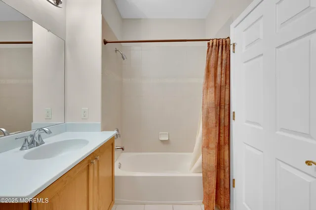 a living room with furniture flowerpot and a chandelier