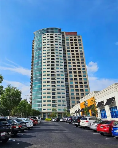 a front view of a building with parking space and parking space