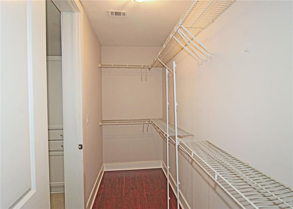 4561 Olde Perimeter Way, Unit 2102 Atlanta, GA 30346 - Photo 15 of 44 a view of a walk in closet