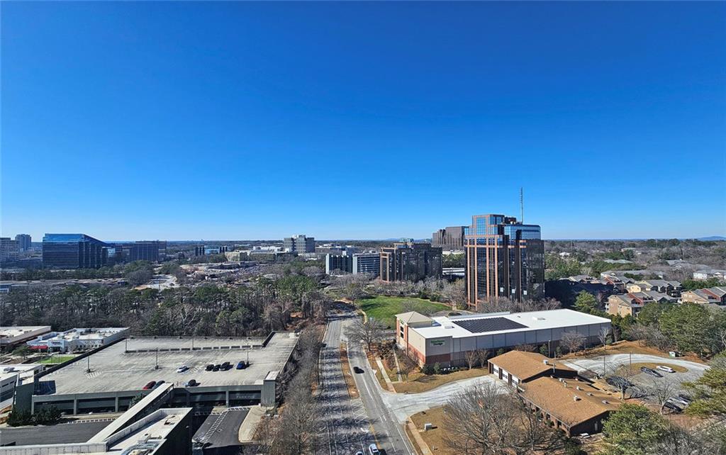 4561 Olde Perimeter Way, Unit 2102 Atlanta, GA 30346 - Photo 22 of 44 a view of a terrace with sitting area