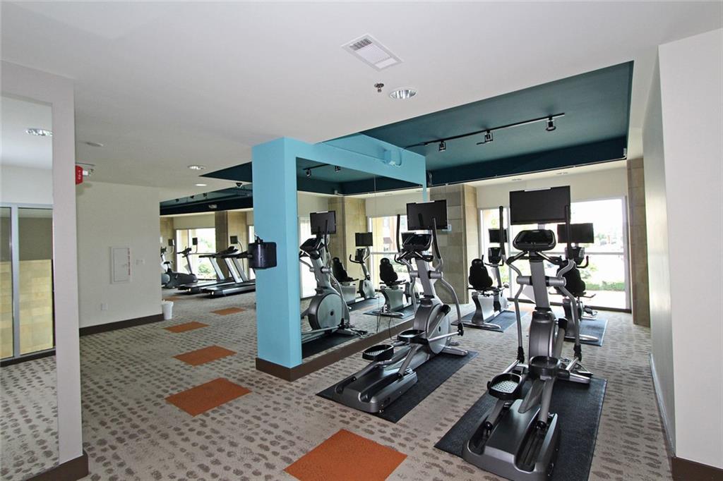 4561 Olde Perimeter Way, Unit 2102 Atlanta, GA 30346 - Photo 29 of 44 a view of a room with gym equipment