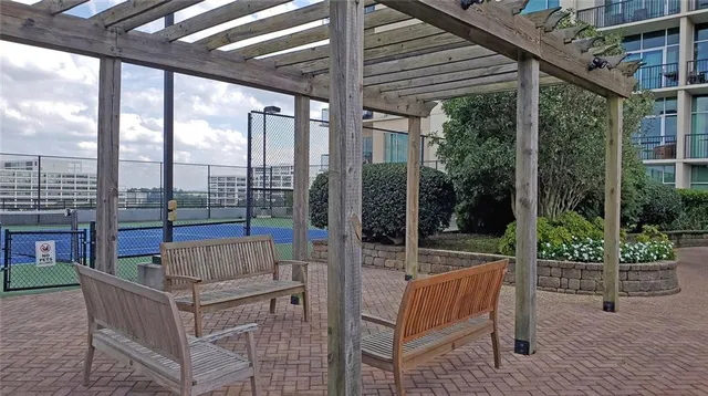 a view of swimming pool with a couches