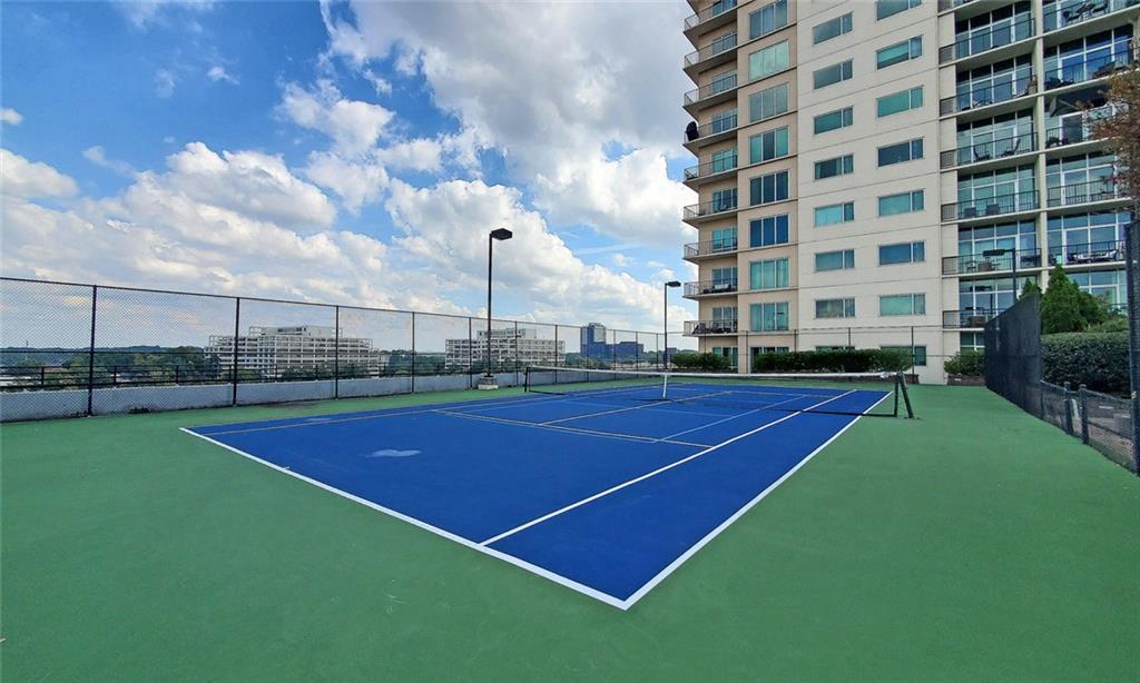 4561 Olde Perimeter Way, Unit 2102 Atlanta, GA 30346 - Photo 43 of 44 a view of a tennis court