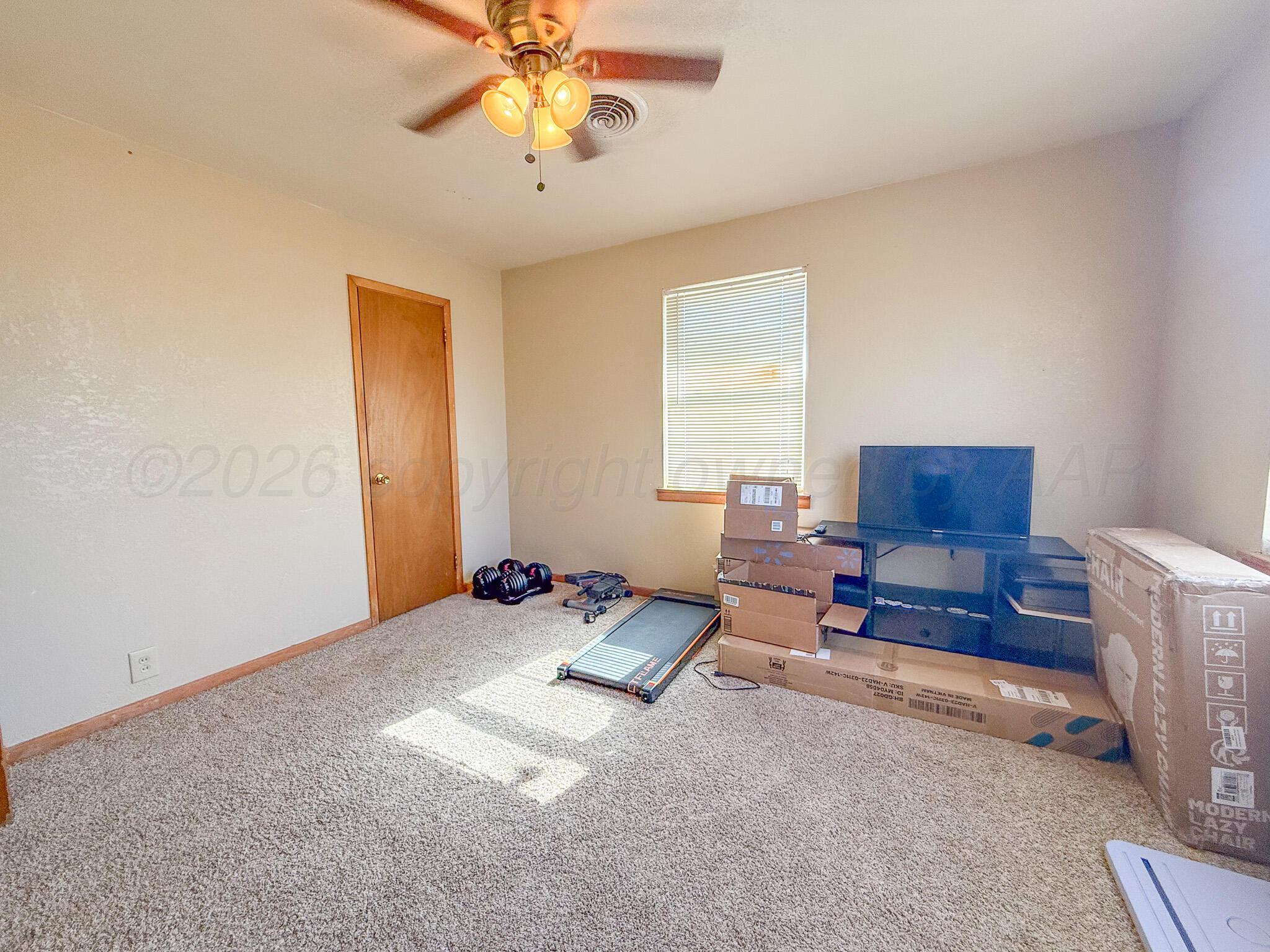 702 South Canadian Street Wheeler, TX 79096 - Photo 29 of 47 a living room with furniture and a window