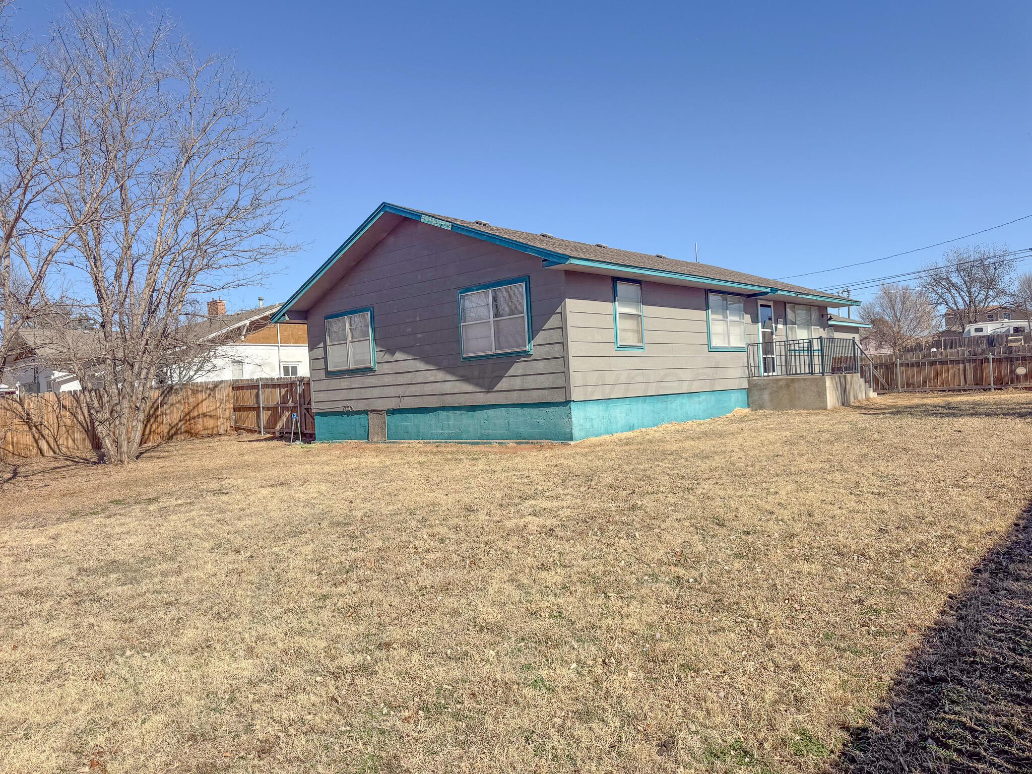 702 South Canadian Street Wheeler, TX 79096 - Photo 40 of 47 a front view of house with yard and trees