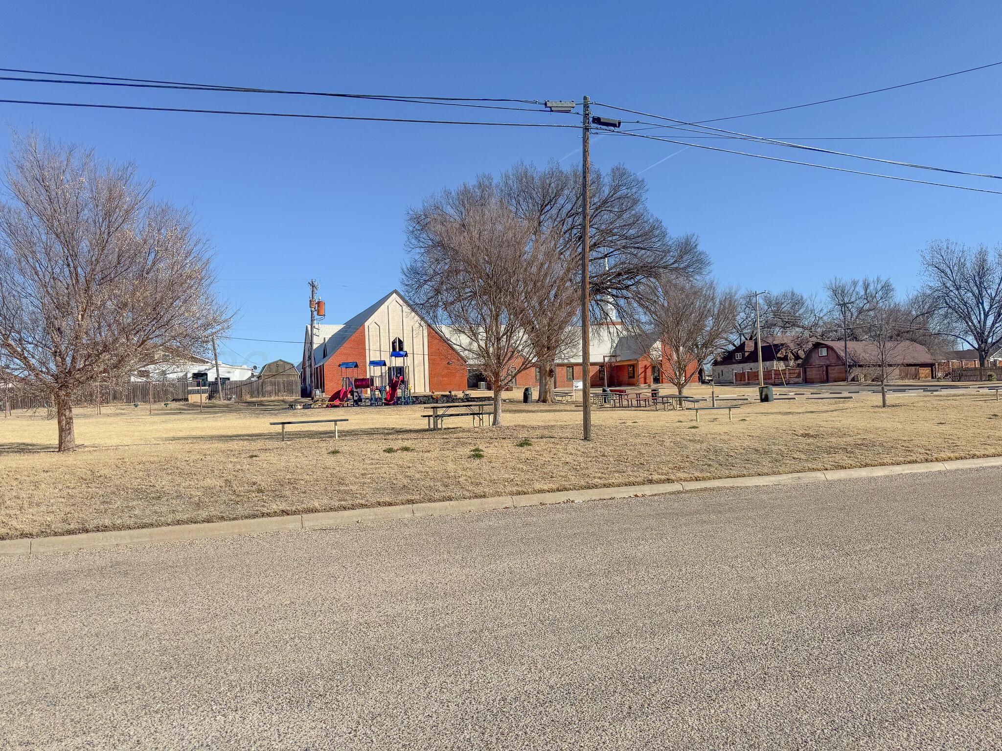 702 South Canadian Street Wheeler, TX 79096 - Photo 45 of 47 a view of a house with a yard