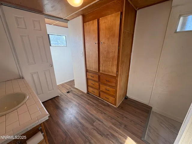 a view of front door with wooden floor