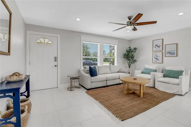 a living room with furniture and windows