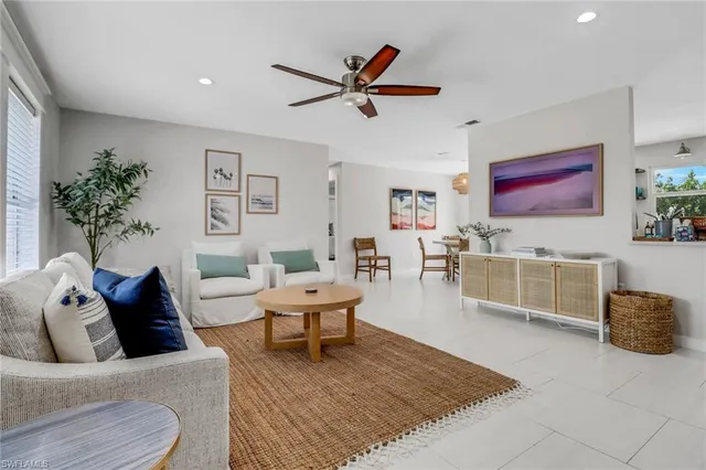 a living room with furniture and a rug