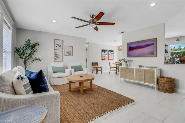 a living room with furniture and a rug