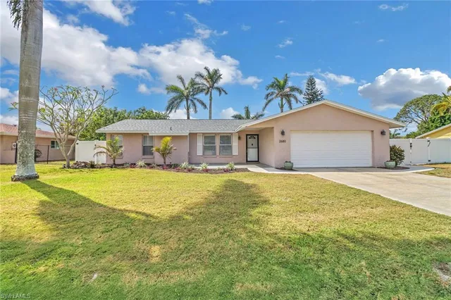 a front view of a house with swimming pool having outdoor seating