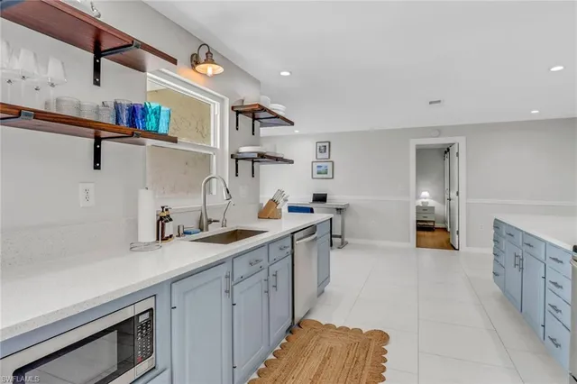 a kitchen with a sink and cabinets