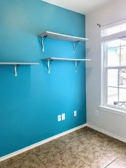 a view of a room with rack on the wall