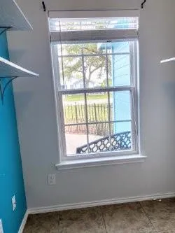 a view of an empty room with a window