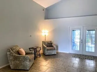 a living room with furniture and window