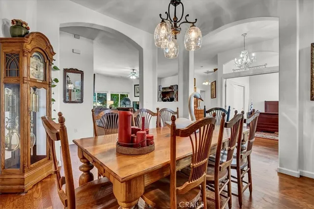 a dining room with furniture and chandelier