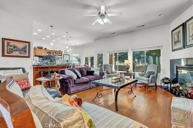 a living room with furniture and kitchen view
