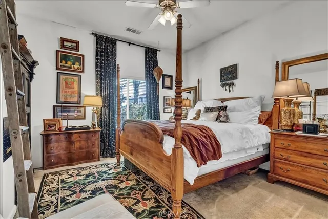 a utility room with stainless steel appliances granite countertop a sink and cabinets