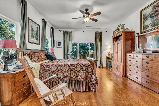 a large white kitchen with granite countertop a sink and cabinets