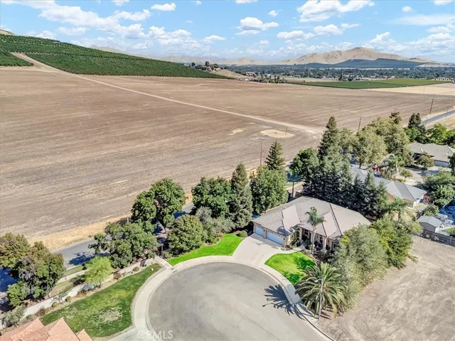 an aerial view of a house with a lake view