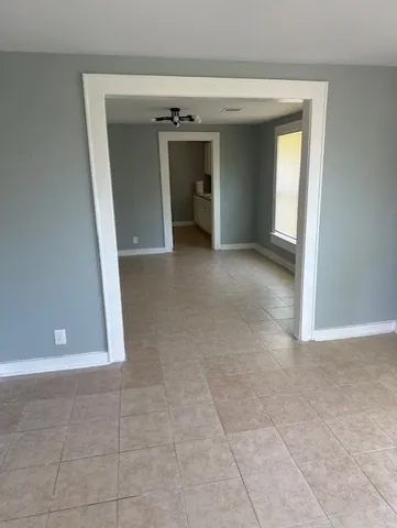 a view of a big room with closet and a fireplace