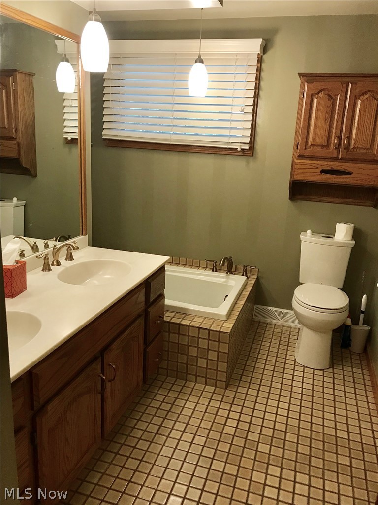 4895 4th Street Northwest Canton, OH 44708 - Photo 18 of 31 Full bath on first floor with tiled floor.