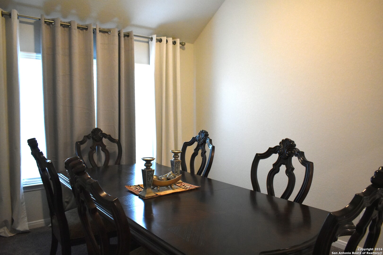 624 Colt Trail Schertz, TX 78154 - Photo 12 of 20 a dining room with furniture and wooden floor