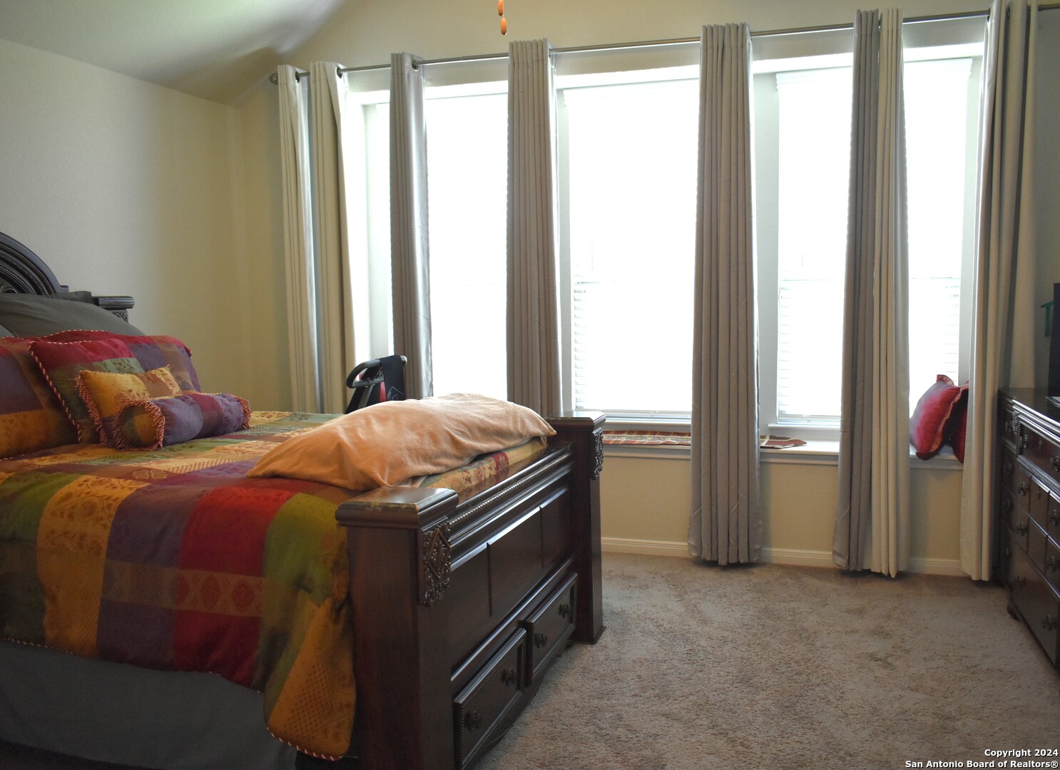 624 Colt Trail Schertz, TX 78154 - Photo 14 of 20 a bedroom with a bed and a window