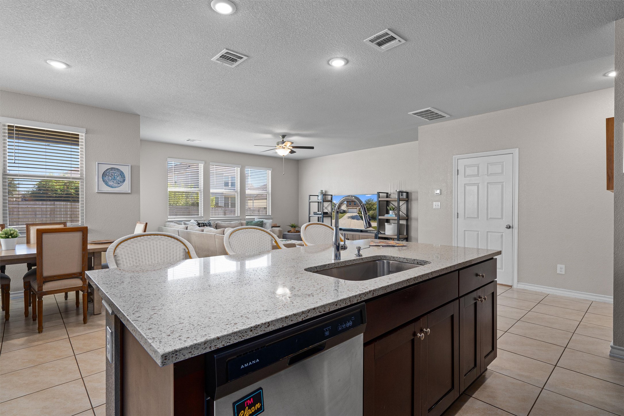 Undisclosed Address Buda, TX 78610 - Photo 14 of 39 a dining hall with stainless steel appliances granite countertop a sink a center island and furniture