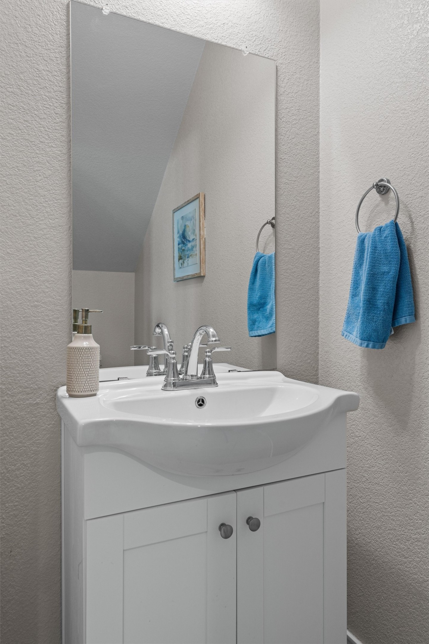 Undisclosed Address Buda, TX 78610 - Photo 16 of 39 a bathroom with a sink and a mirror