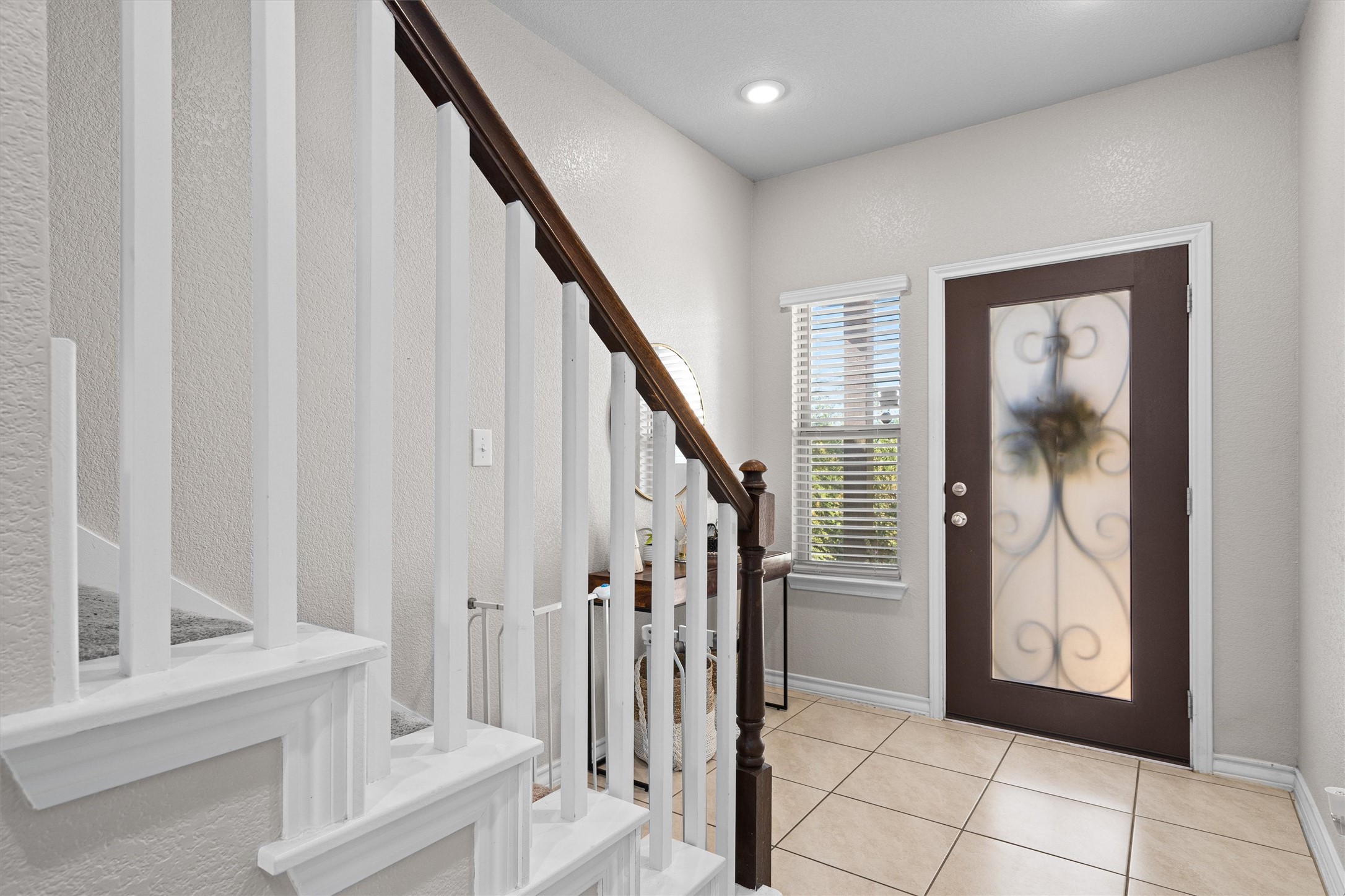 Undisclosed Address Buda, TX 78610 - Photo 17 of 39 a view of front door with stairs