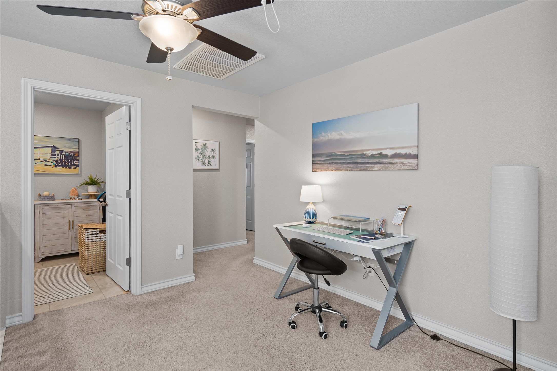 Undisclosed Address Buda, TX 78610 - Photo 20 of 39 a view of a workspace with furniture and a window