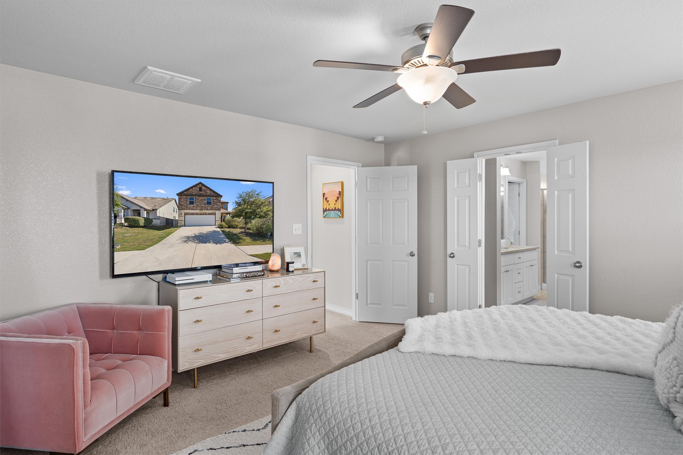 Undisclosed Address Buda, TX 78610 - Photo 23 of 39 a bedroom with bed tv and couch