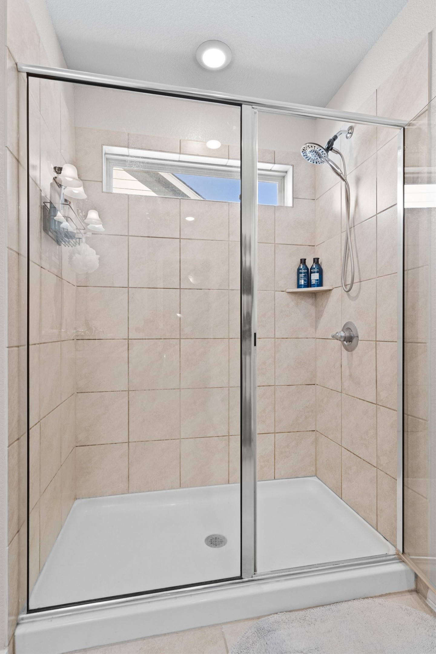 Undisclosed Address Buda, TX 78610 - Photo 26 of 39 a bathroom with a bathtub and a shower