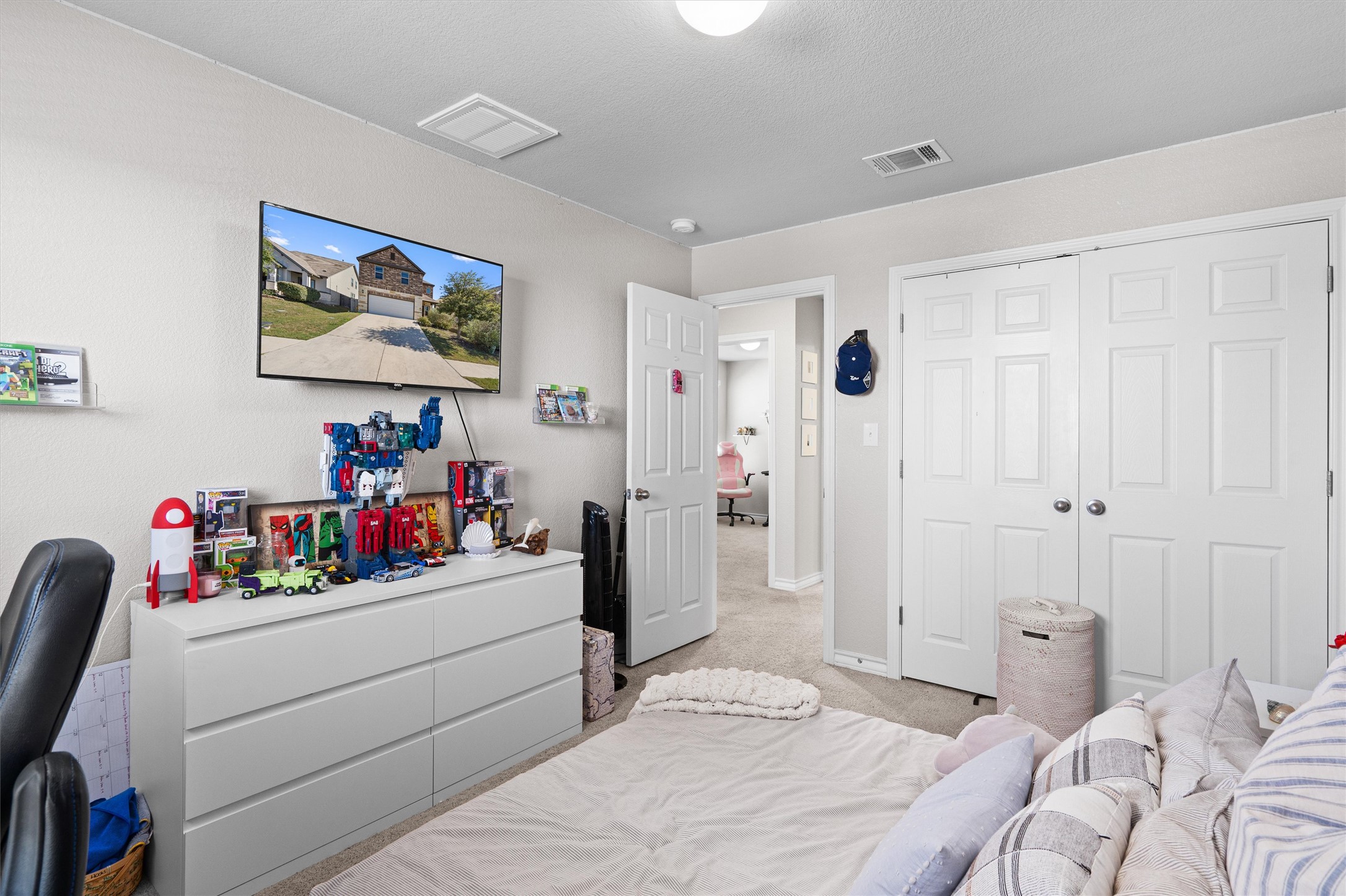 Undisclosed Address Buda, TX 78610 - Photo 29 of 39 a bedroom with a bed and a window