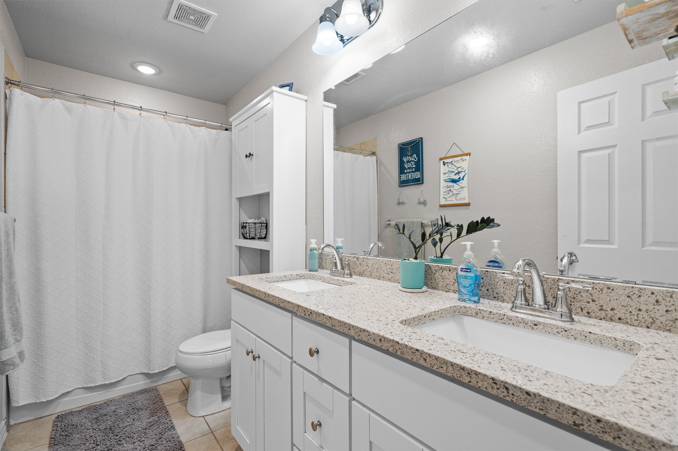Undisclosed Address Buda, TX 78610 - Photo 34 of 39 a bathroom with a granite countertop sink and a mirror
