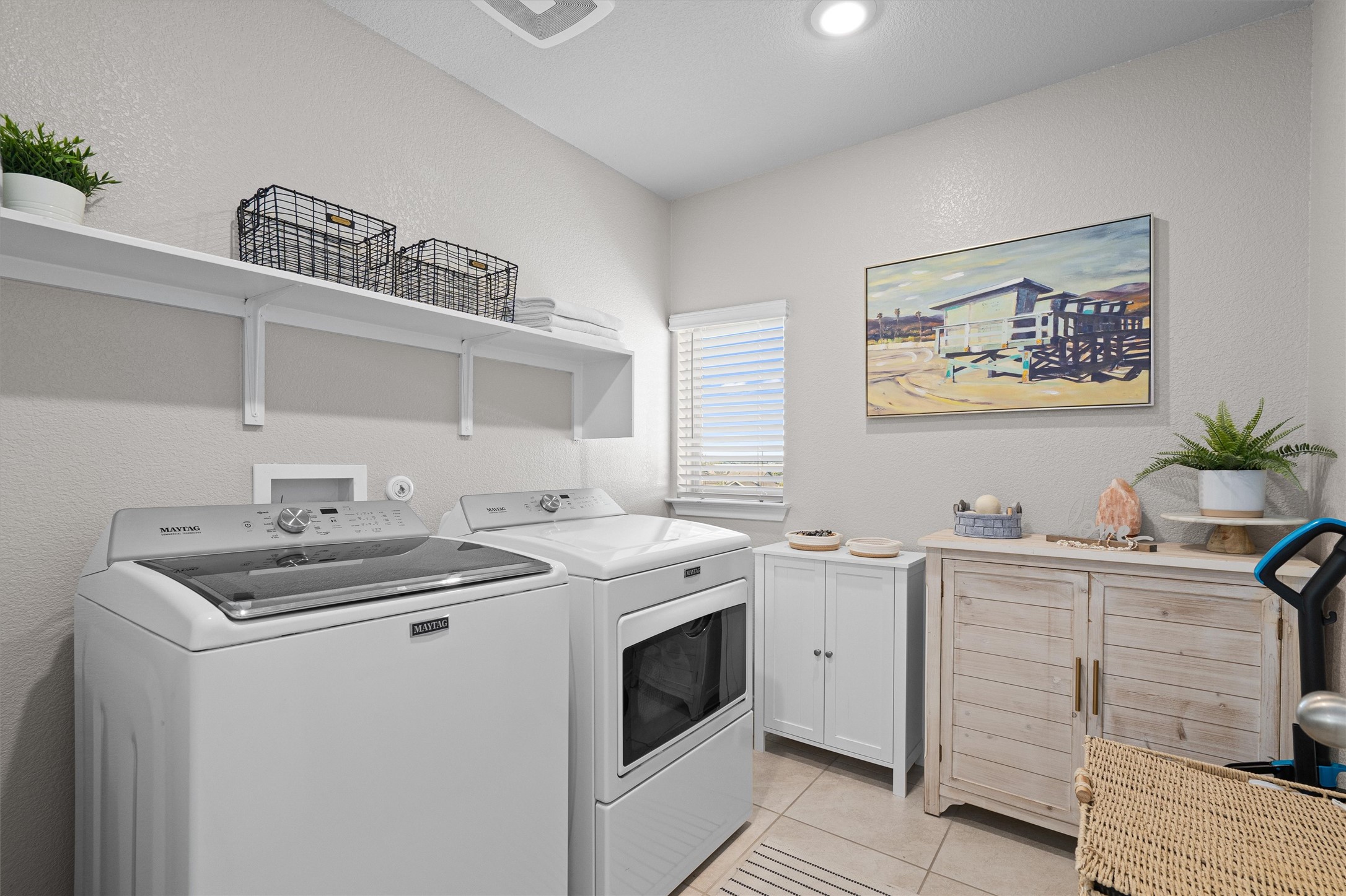 Undisclosed Address Buda, TX 78610 - Photo 35 of 39 a view of cabinets with washer and dryer