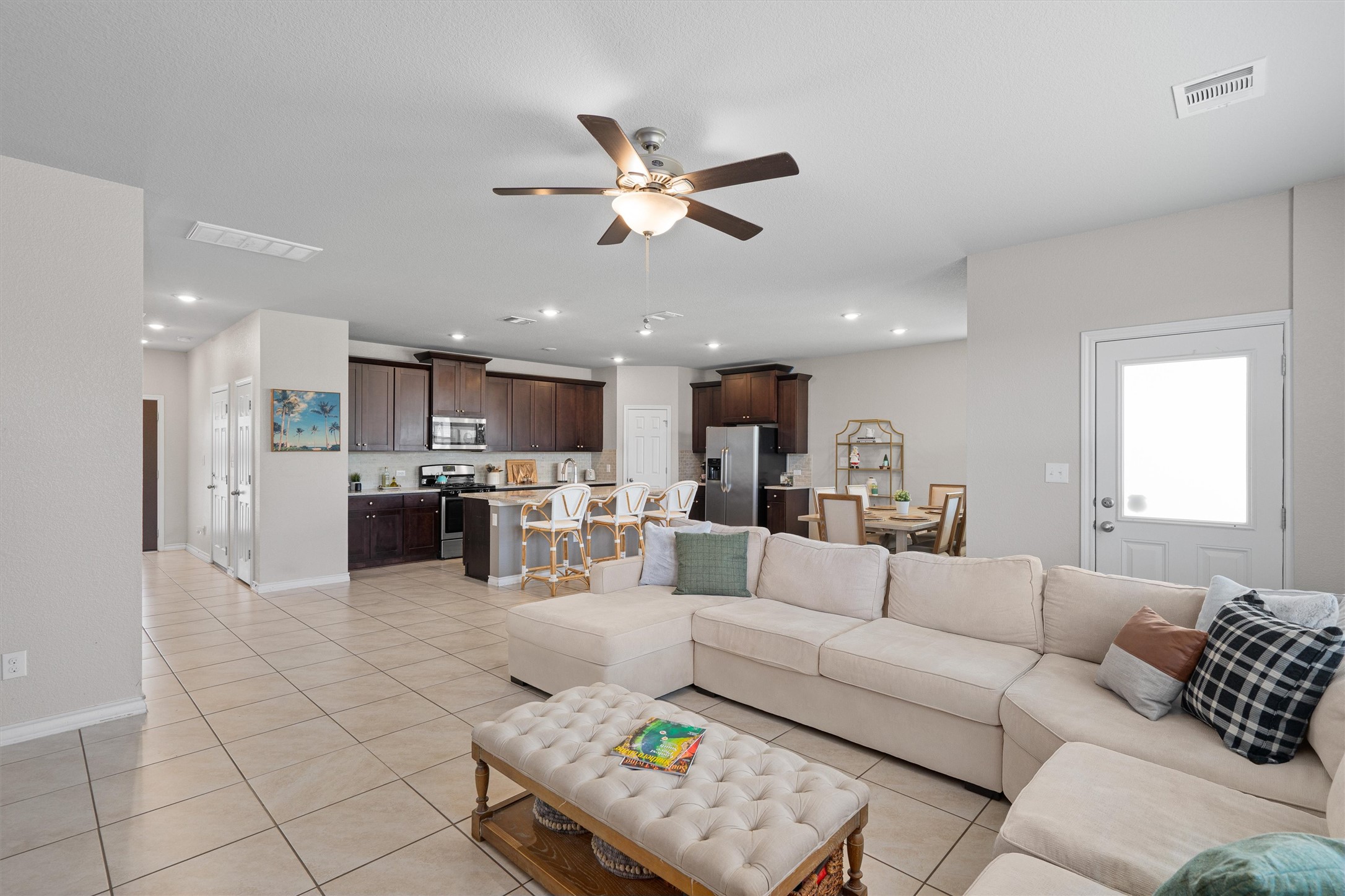 Undisclosed Address Buda, TX 78610 - Photo 9 of 39 a living room with furniture kitchen view and a chandelier