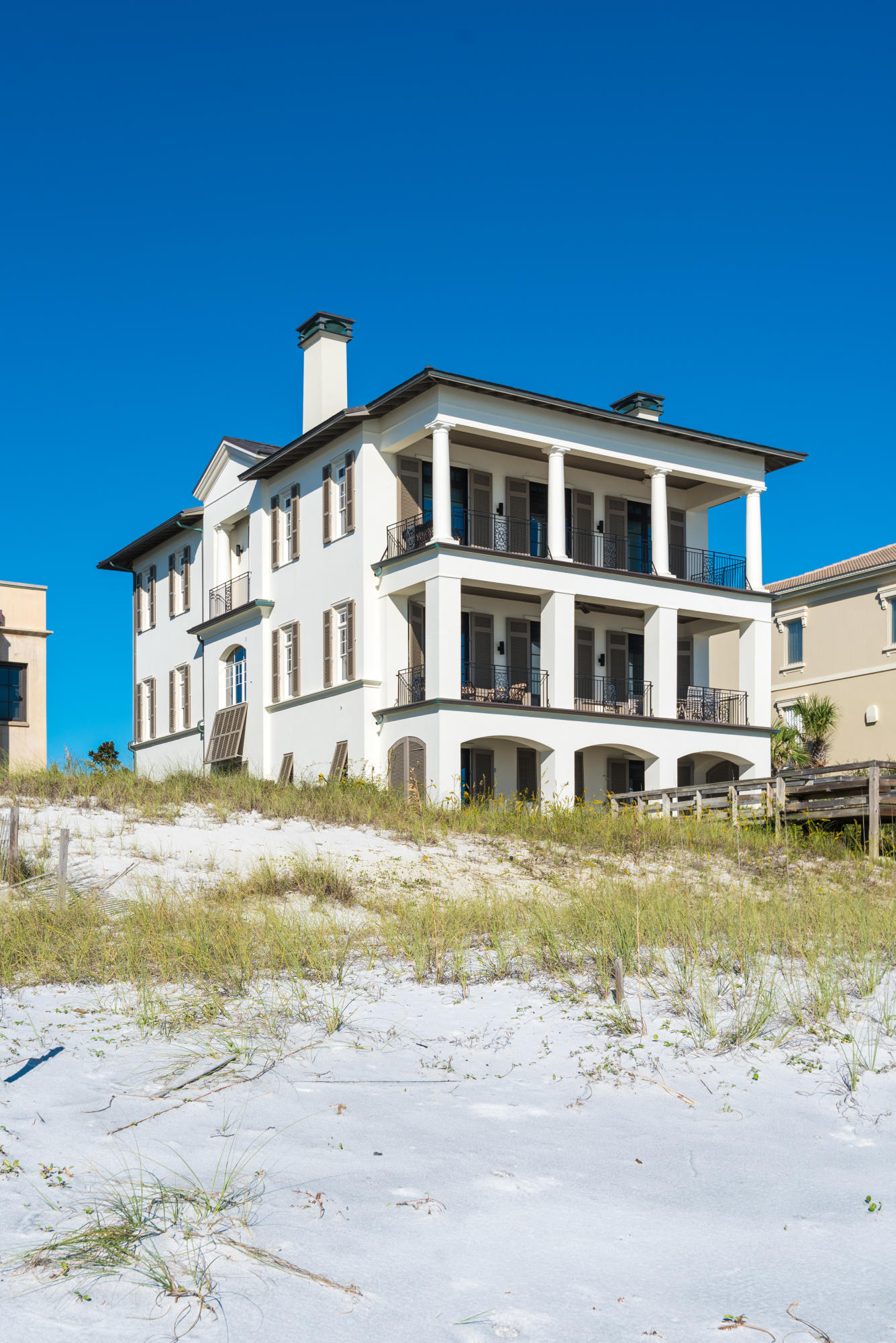 25 Stallworth Boulevard Santa Rosa Beach, FL 32459 - Photo 2 of 38 a view of a large pool with a lawn chairs and wooden fence