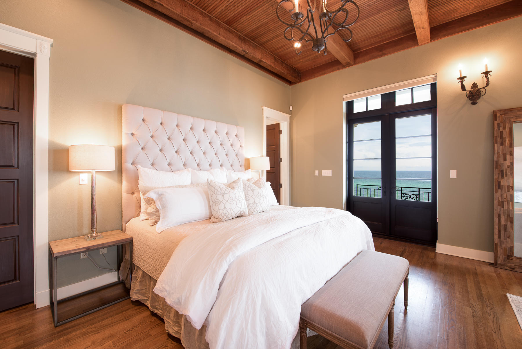 25 Stallworth Boulevard Santa Rosa Beach, FL 32459 - Photo 27 of 38 a bedroom with a large bed and a chandelier