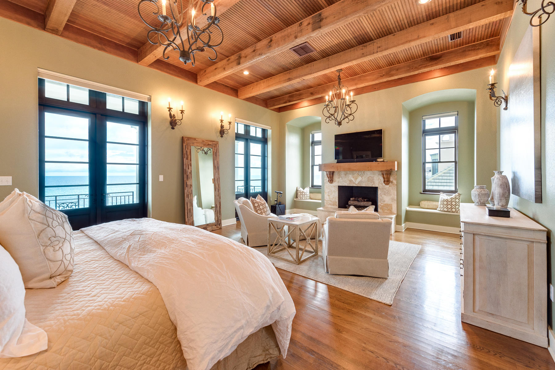 25 Stallworth Boulevard Santa Rosa Beach, FL 32459 - Photo 5 of 38 a spacious bedroom with a balcony a bed and a wooden floor